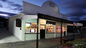 A building with a sign indicating it is an accommodation with a vacancy. - Lavender Apartment 2  One bedroom Apartment (Coromandel Township)