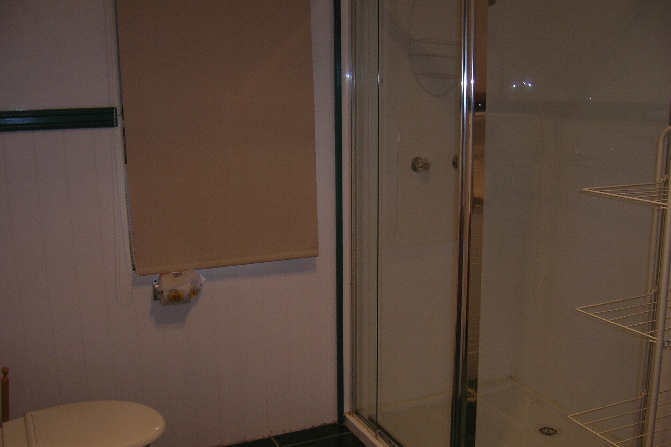 Shower, hair dryer, towels, toilet paper