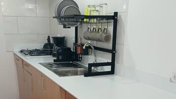 Fridge, microwave, stovetop, coffee/tea maker