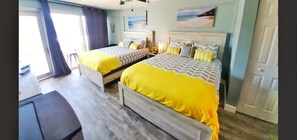 Comfort Studio, 2 Queen Beds, Kitchen, Partial Ocean View | Individually decorated, individually furnished, desk, iron/ironing board - Daytona Inn Studios (Daytona Beach)