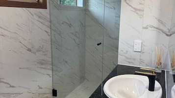 Shower, hair dryer, towels, soap