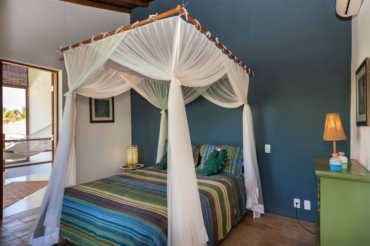 Desk, iron/ironing board, bed sheets
