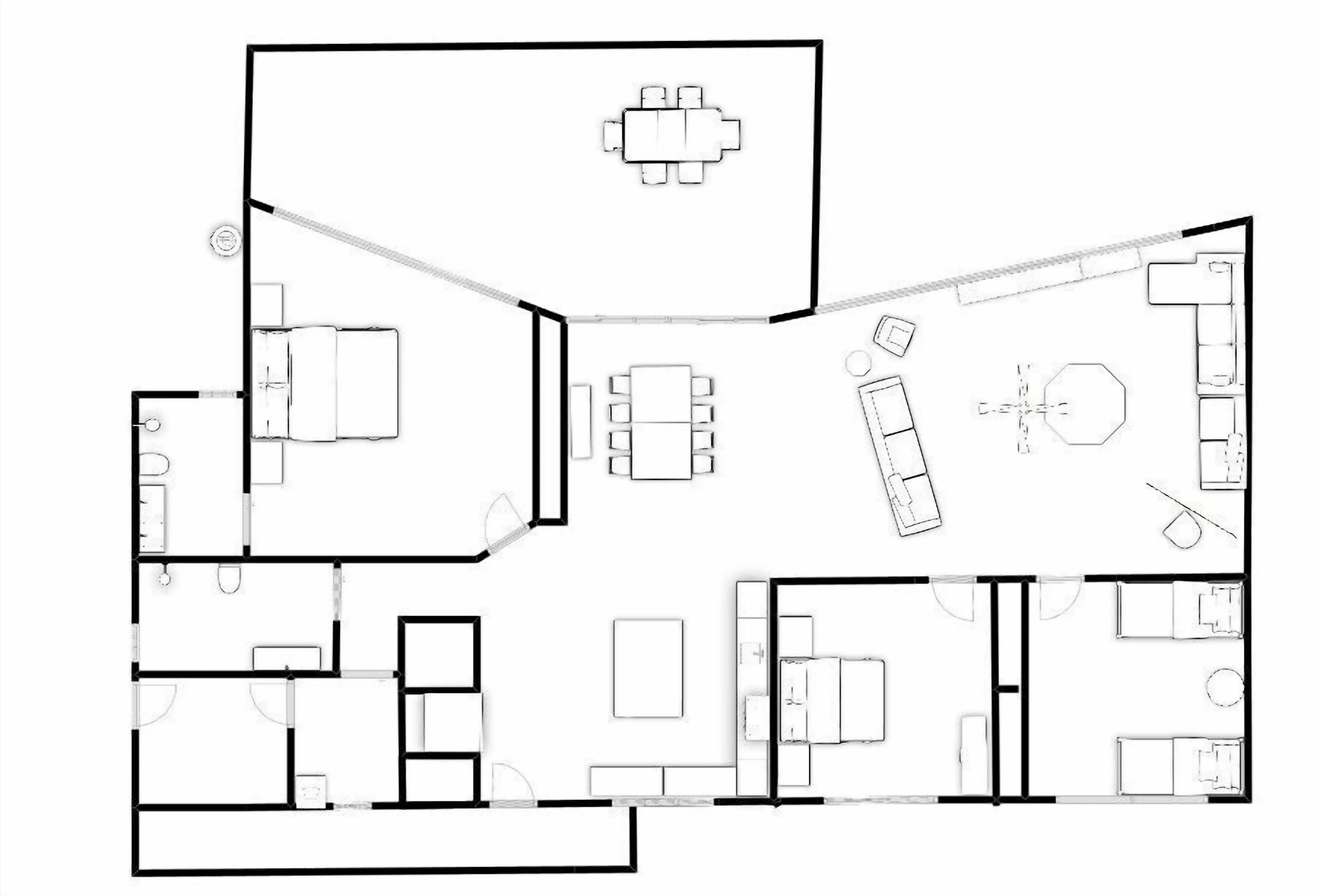 A floor plan of a hotel with multiple rooms, a dining area, and a kitchen.