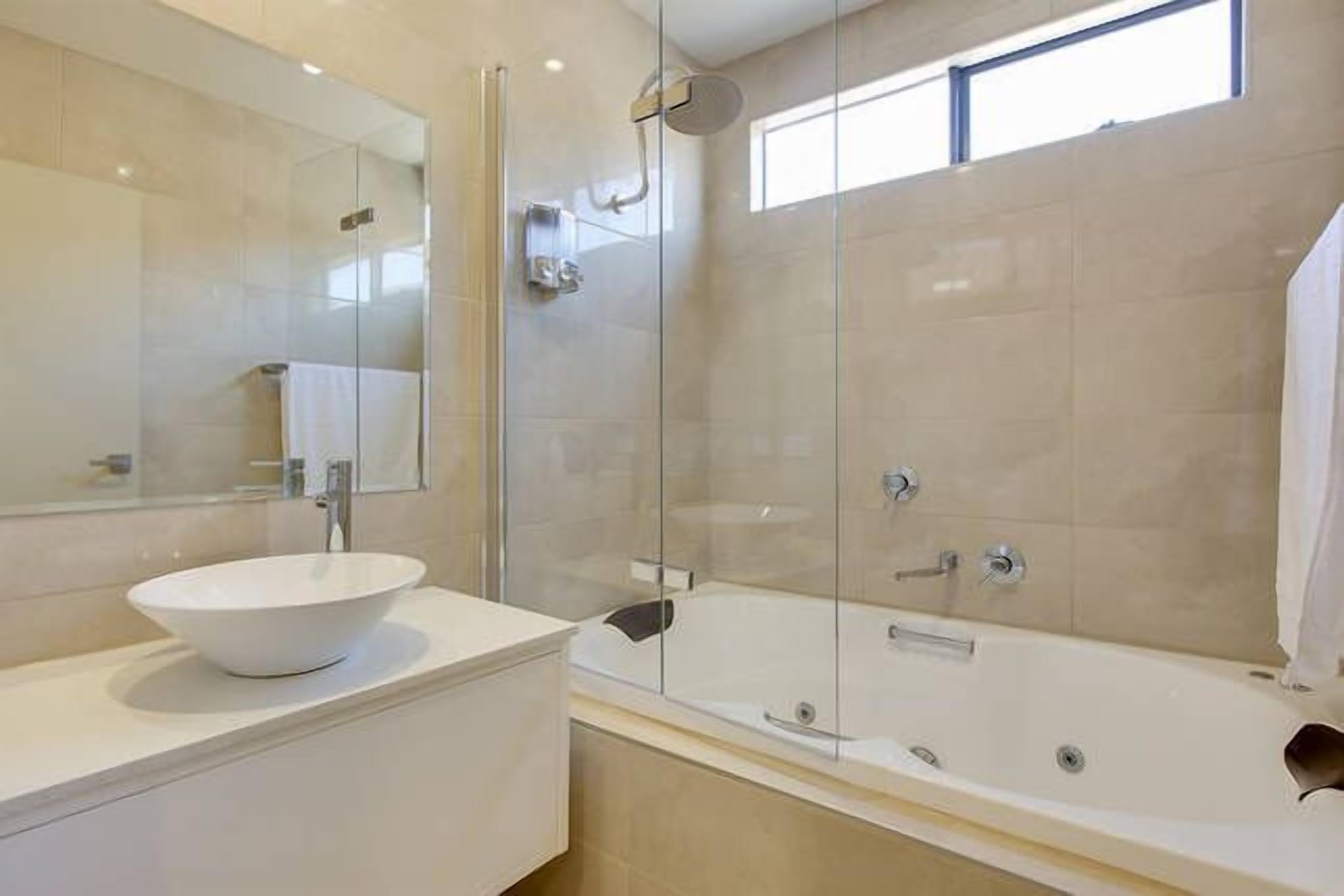 Combined shower/bathtub, hair dryer, towels, soap