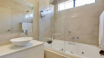 Combined shower/bathtub, hair dryer, towels, soap