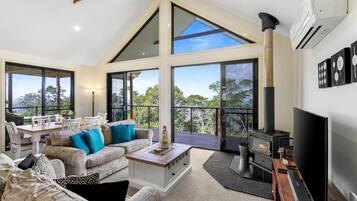 Flat-screen TV, fireplace, DVD player, stereo