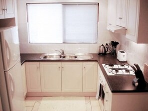 Fridge, microwave, coffee/tea maker, high chair