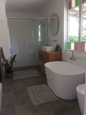 Bathtub, hair dryer, towels, soap