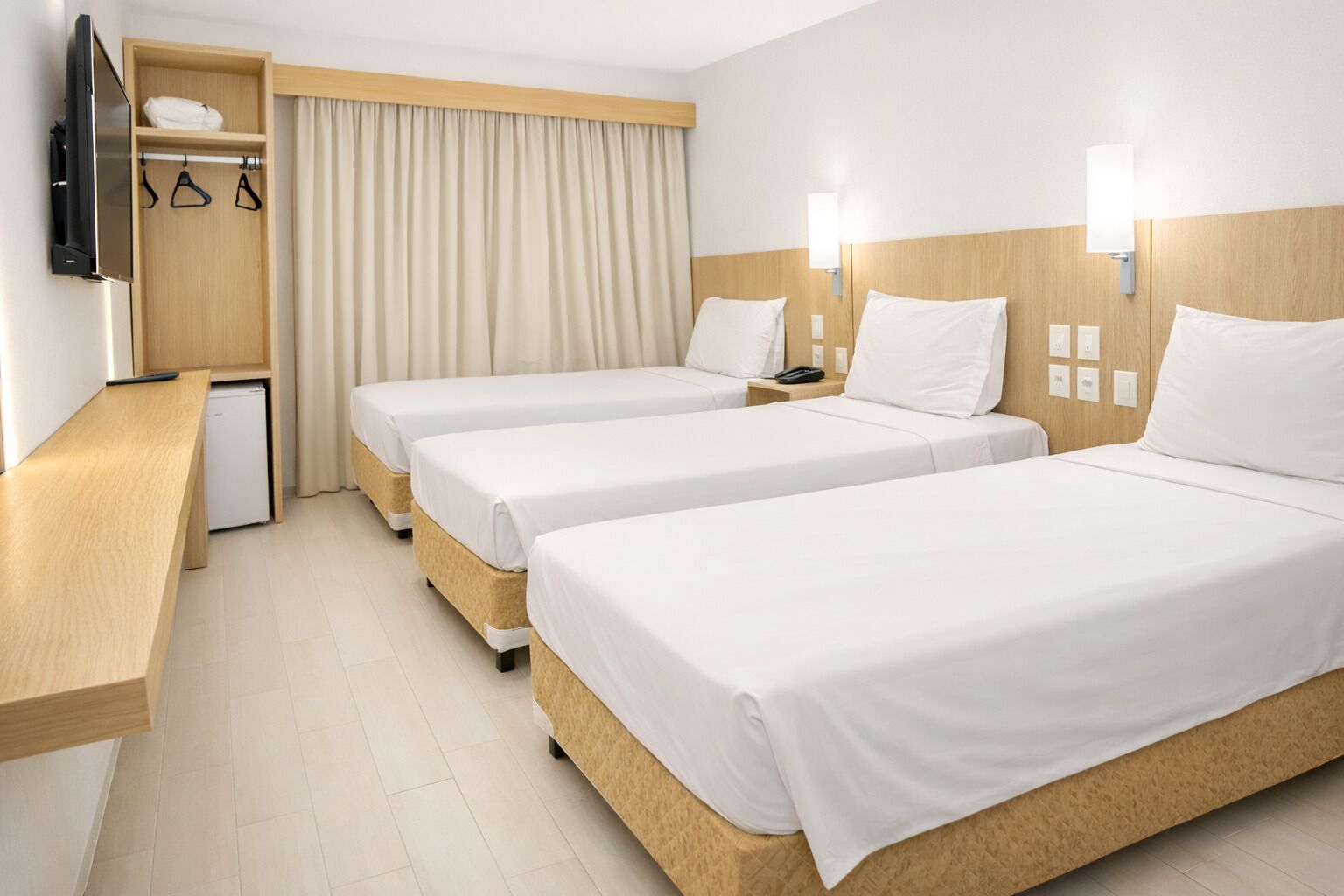 Standard Triple Room | Minibar, desk, laptop workspace, blackout curtains