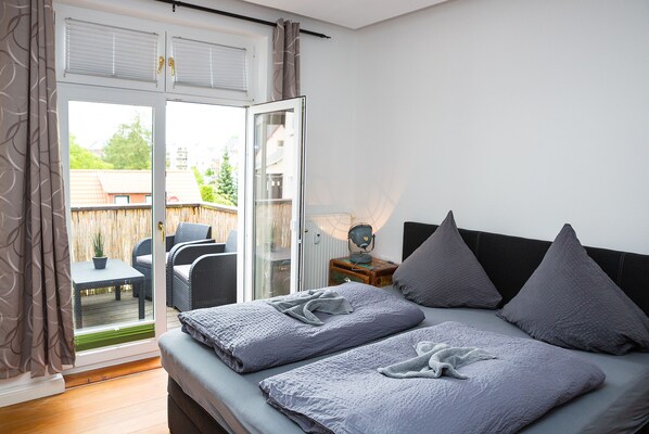 Apartamento, 2 quartos | Berços (sobretaxa), Wi-Fi de cortesia, roupa de cama