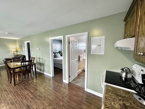 Deluxe Suite, 2 Bedrooms, Non Smoking, Kitchen | Living area - Stay in Gros Morne (Rocky Harbour)