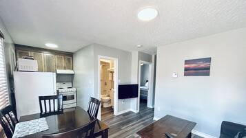 A two-bedroom cottage with a kitchen, dining area, and living room.
