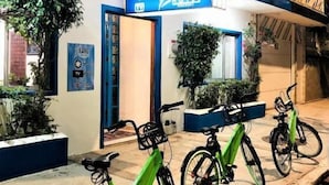 A hotel named "El Faro Hotel" with a blue and white facade, a signboard, and three bicycles parked outside. - Hotel El Faro Veracruz (Veracruz)