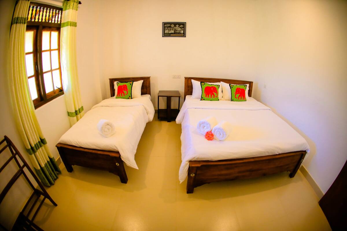Deluxe Triple Room, Multiple Beds, Accessible, Hill View | Memory foam beds, desk, WiFi (free), bed sheets