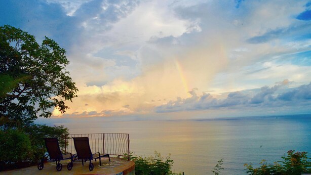 A poolside area with two lounge chairs and a view of the ocean at sunset. - Montezuma Heights "Geco" studio. In between ocean and the wild. Sleeps 2 (Montezuma)