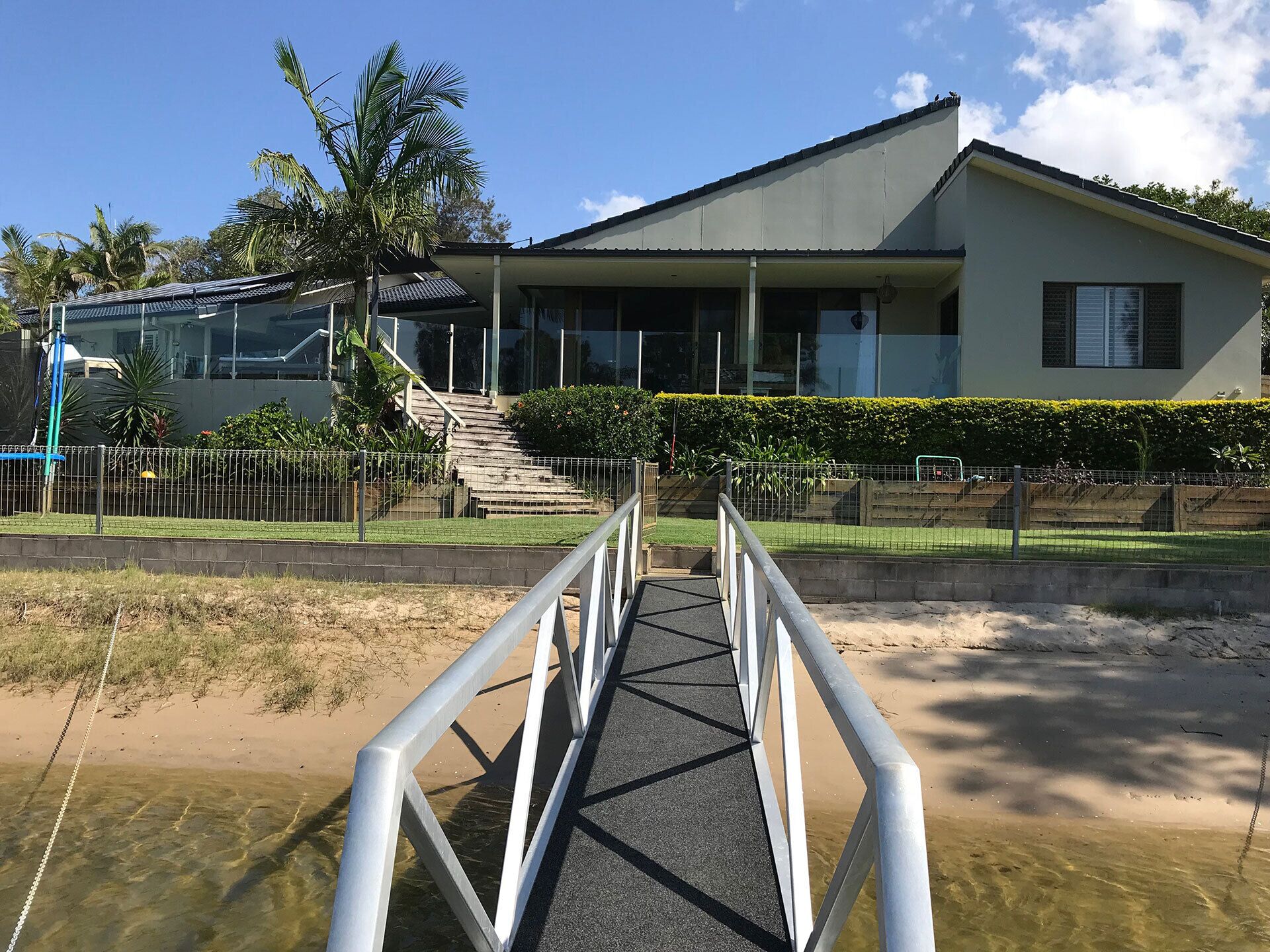 ENJOY THE SPECTACULAR WATER FRONT VIEWS FROM THE COVERED PATIO