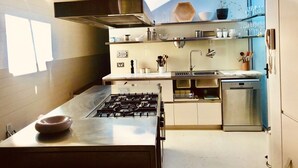 A modern kitchen with a gas stove, stainless steel appliances, and ample storage space. - The Abode - 2-3 bedrooms - premium, spacious, light-filled and harbour views (Birchgrove)
