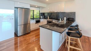 Coffee/tea maker, fridge, oven, stovetop - Pinnacle 3, Seaview Apartment on Hamilton Island (Hamilton Island)