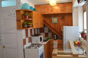 Fridge, microwave, mixer, cookware/dishes/utensils