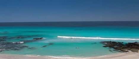 On the beach, sun loungers, beach umbrellas