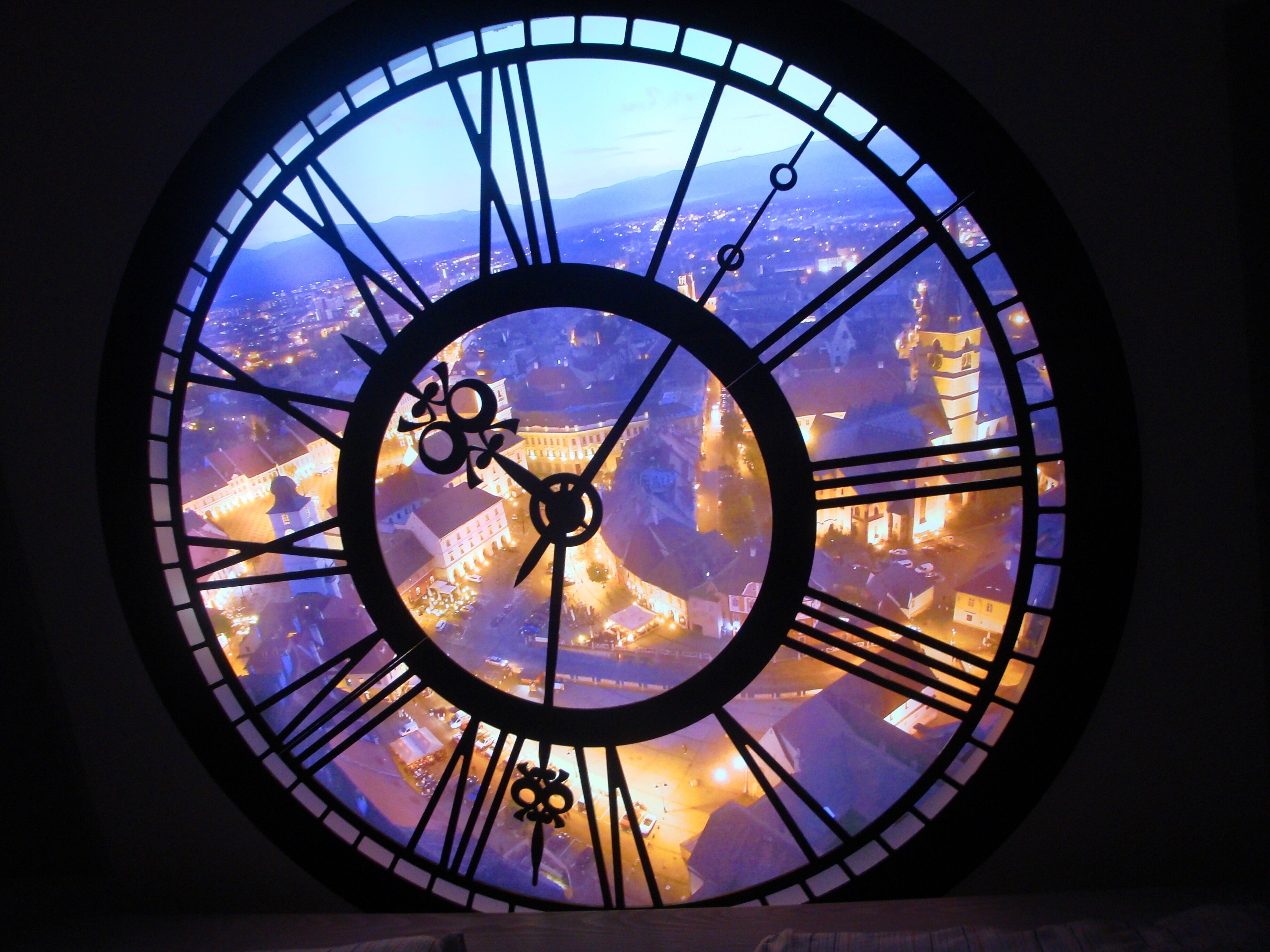 Decorative clock overlooking Main Square in Sibiu