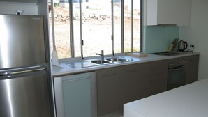 A modern kitchen with stainless steel appliances, a dishwasher, and a sink. - Quiet Getaway Only Minutes to Beach (Encounter Bay)