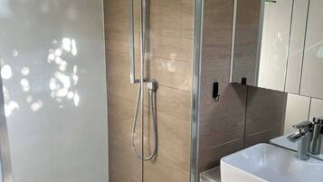 Shower, hair dryer, towels, soap