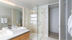 Combined shower/tub, hair dryer, towels, soap