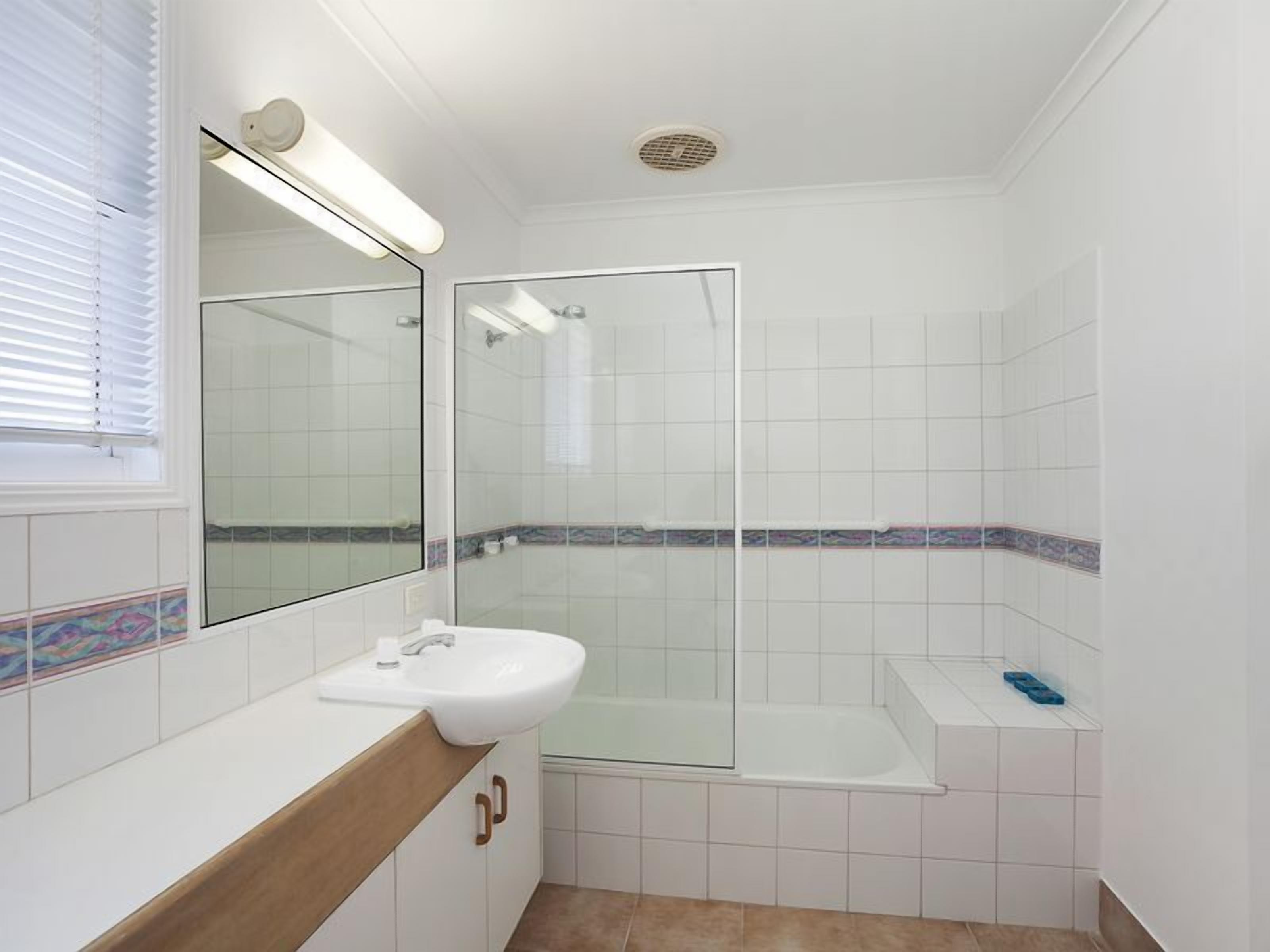 bathroom with bath/shower/
