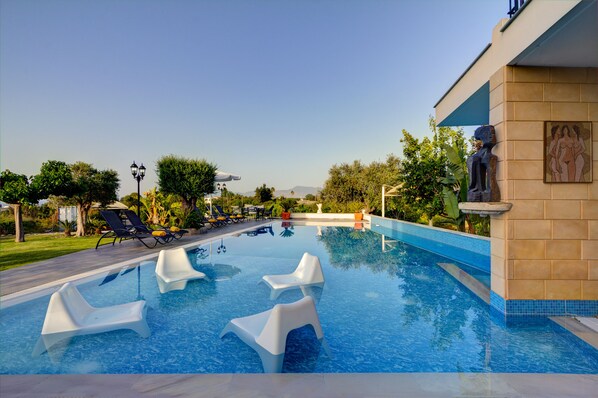Outdoor pool, pool umbrellas, pool loungers