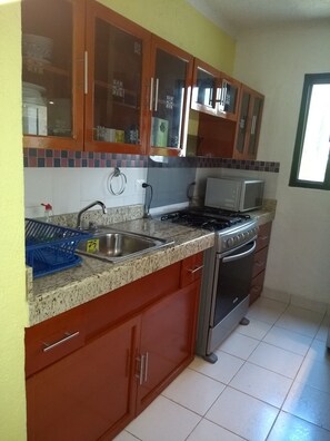 Microwave, oven, coffee/tea maker, cookware/dishes/utensils