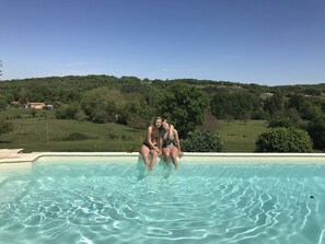 A heated pool, pool loungers