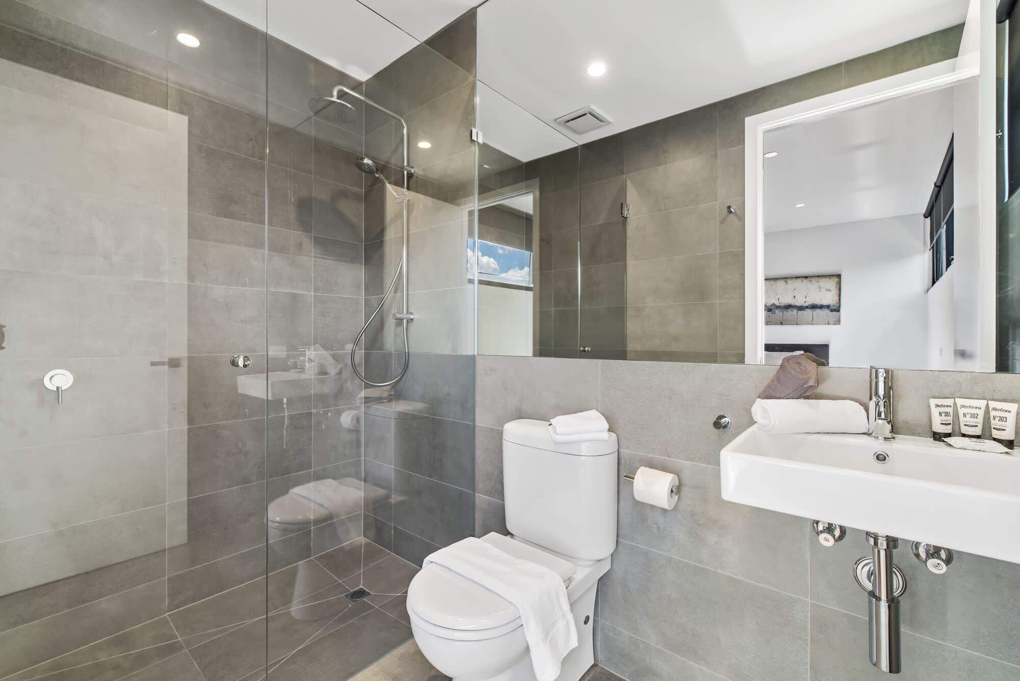 Shower, hair dryer, towels, shampoo