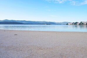 On the beach, sun-loungers