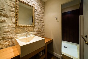 Bathtub, hair dryer, towels, soap