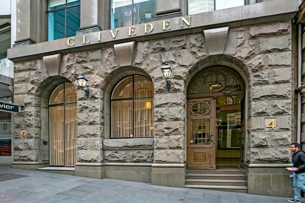 Stunning stone facade with arched windows and a welcoming entrance.
