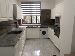 Fridge, microwave, oven, stovetop - Two Bedroom Fully Furnished Apartment (Osu Klottey)