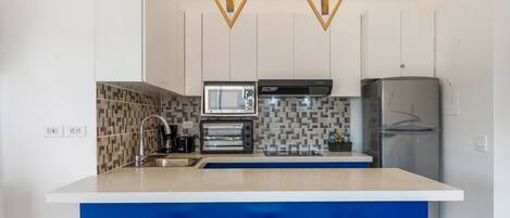 Fridge, microwave, stovetop, coffee/tea maker