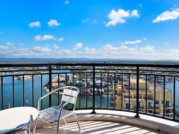 Enjoy the city view from this balcony with a clear view of the cityscape below.