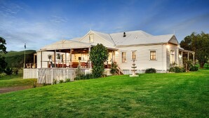 A large, two-story house with a covered porch and a well-maintained lawn. - Woolamai Park Suits 2-3 Families LARGE 7 Bedrooms (Woolamai)