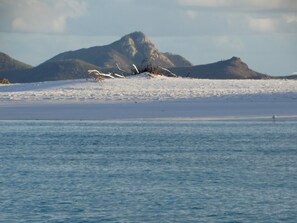 On the beach, sun-loungers