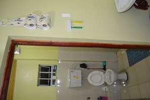 Shower, hair dryer, towels, toilet paper