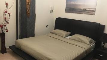 1 habitación, tabla de planchar con plancha, internet y ropa de cama