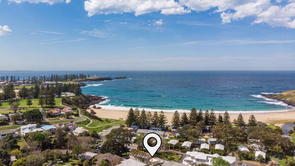 Enjoy ocean views from this coastal residential area with access to a sandy beach and scenic rocky coastline.