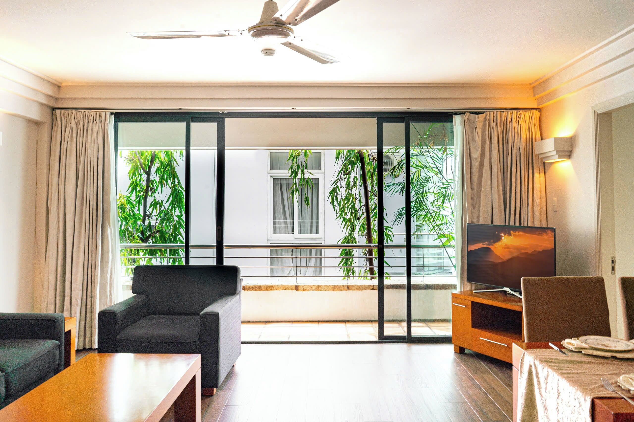 Deluxe Apartment, 2 Bedrooms | Living area | 32-inch TV with cable channels