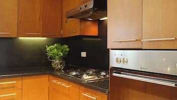 Deluxe Apartment, 2 Bedrooms | Private kitchen | Fridge, microwave, oven, stovetop