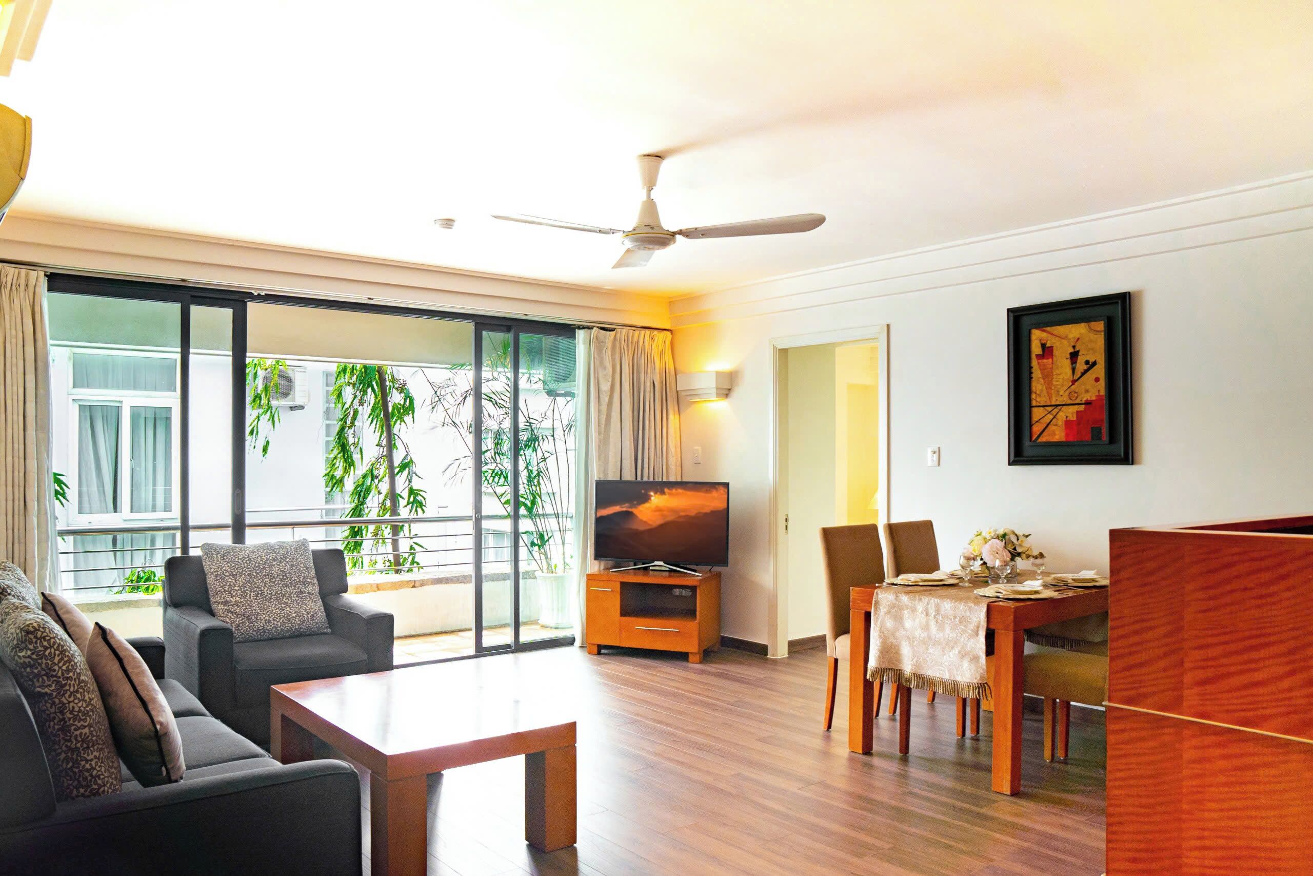 Deluxe Apartment, 2 Bedrooms | Living area | 32-inch TV with cable channels