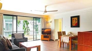 Deluxe Apartment, 2 Bedrooms | Living area | 32-inch TV with cable channels