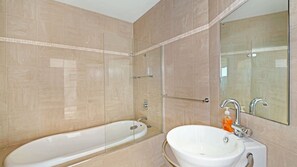Bathtub, hair dryer, towels