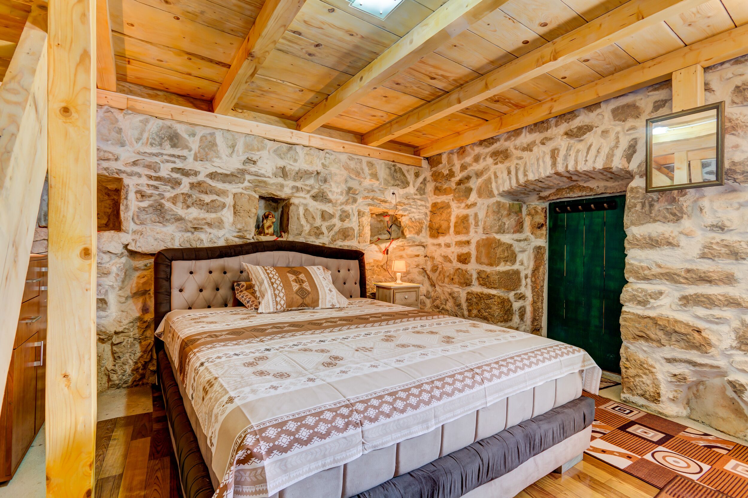 Bedroom with Queen size bad night table and night lamp